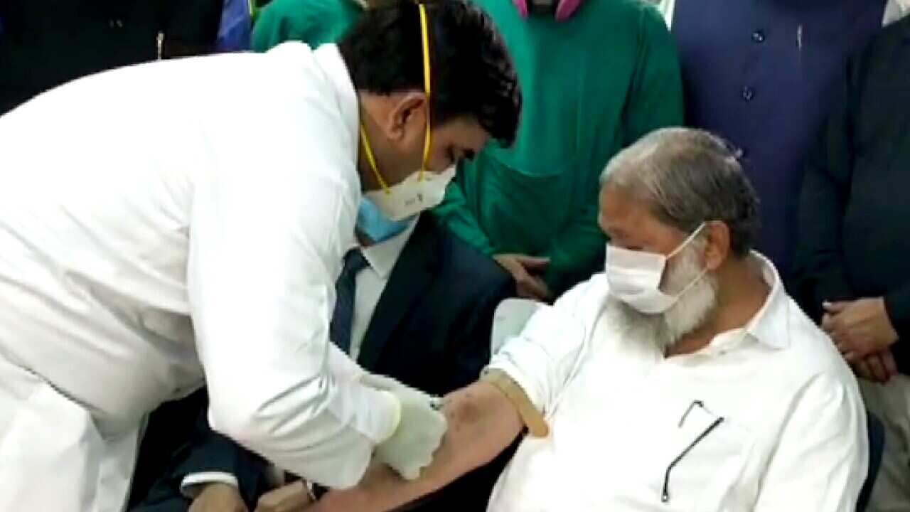 Haryana Health Minister Anil Vij being administered a trial dose of Covaxin