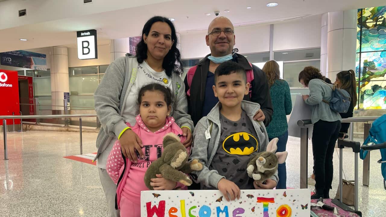 Shadi Al Daoud with his wife, Ramia, and their two children are seen with their luggage at the airport after arriving in Australia.