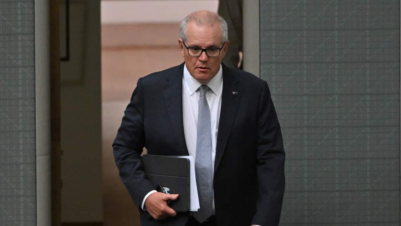 Former prime minister Scott Morrison walks into the House of Representatives at Parliament House in Canberra.