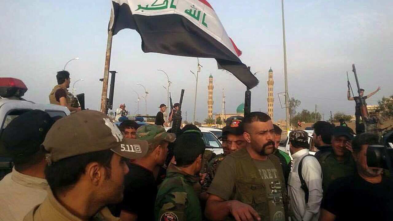Iraqi security forces and tribal fighters gather in central Ramadi before attacking Islamic State extremists in Ramadi, 70 miles (115 kilometers) west of Baghdad, Iraq, Wednesday, April 15, 2015. (AP Photo)