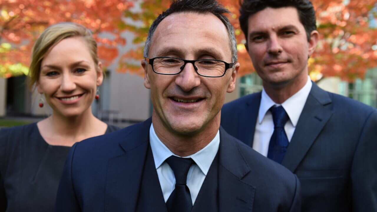 Greens MPs Richard Di Natale (C), Scott Ludlam (R) and Larissa Waters