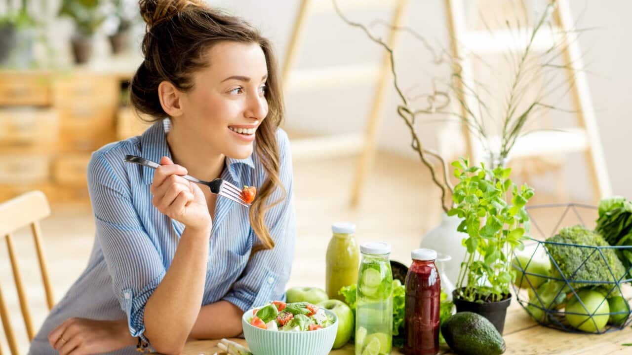 Woman eating healthy salad