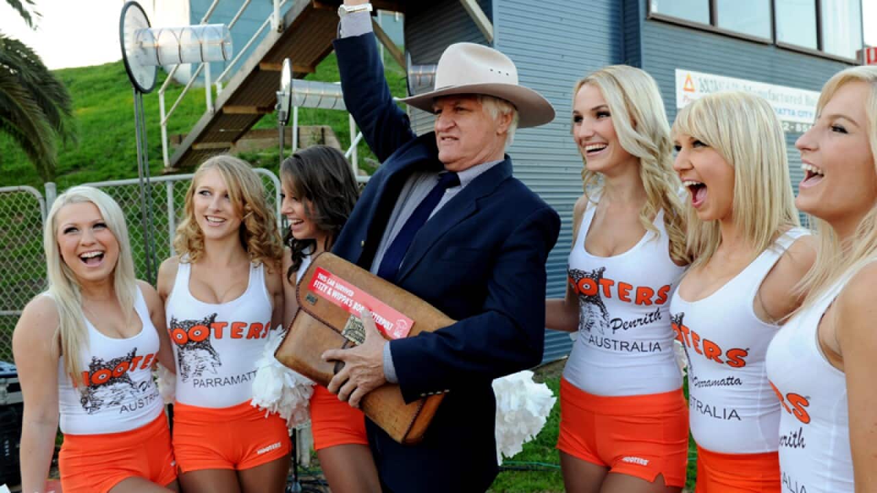 Australian politician Bob Katter with Hooters girls.