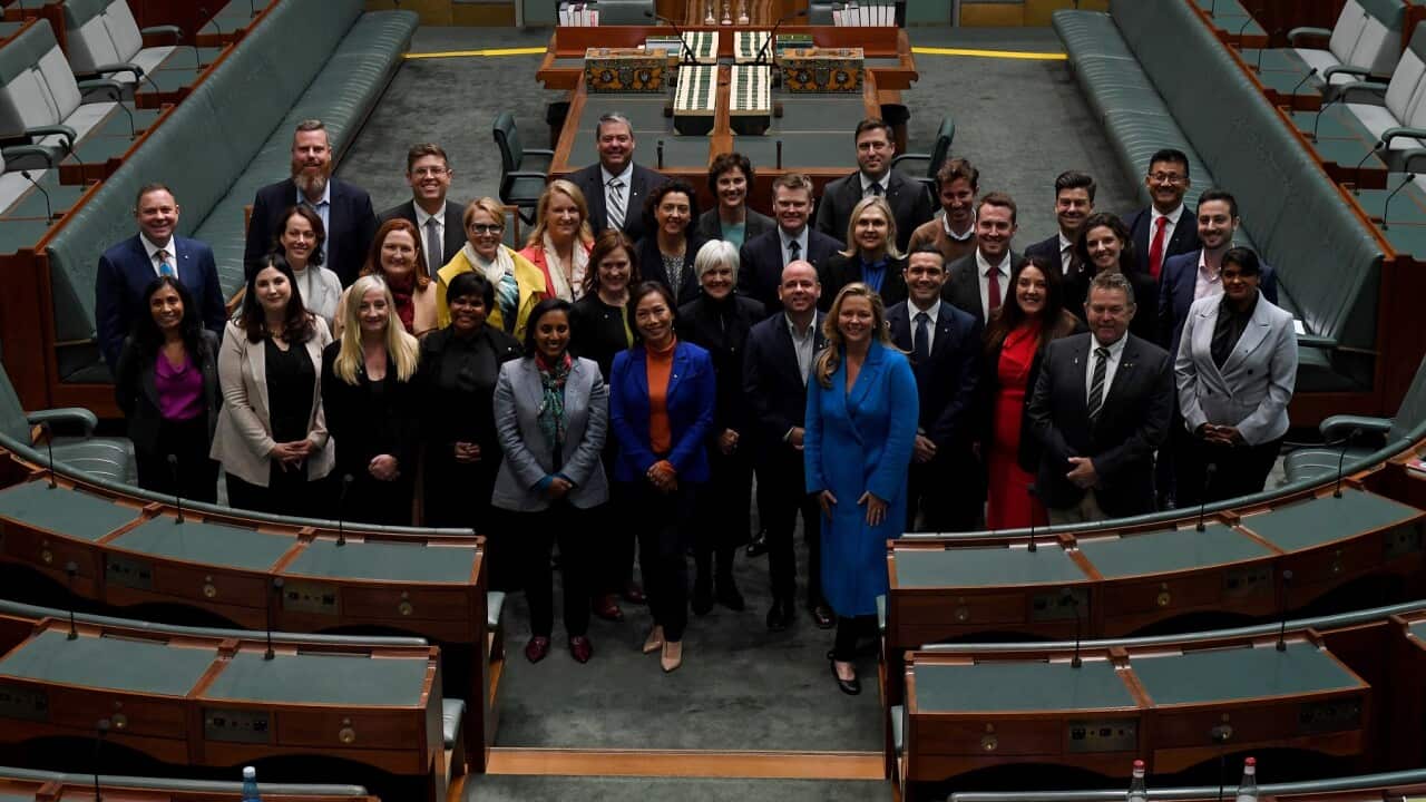 Australia’s newly-elected MPs pose for a photograph at Parliament House in Canberra