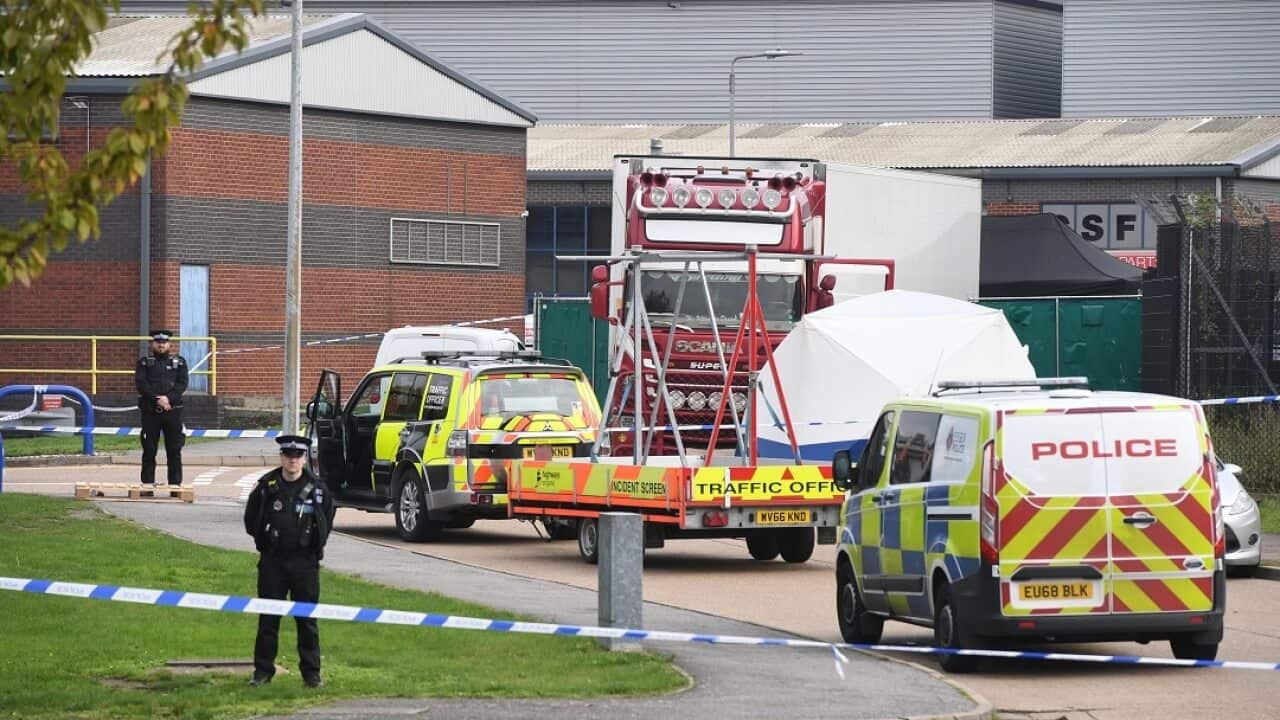 Police at the Waterglade Industrial Park where 39 bodies were found inside a truck container.