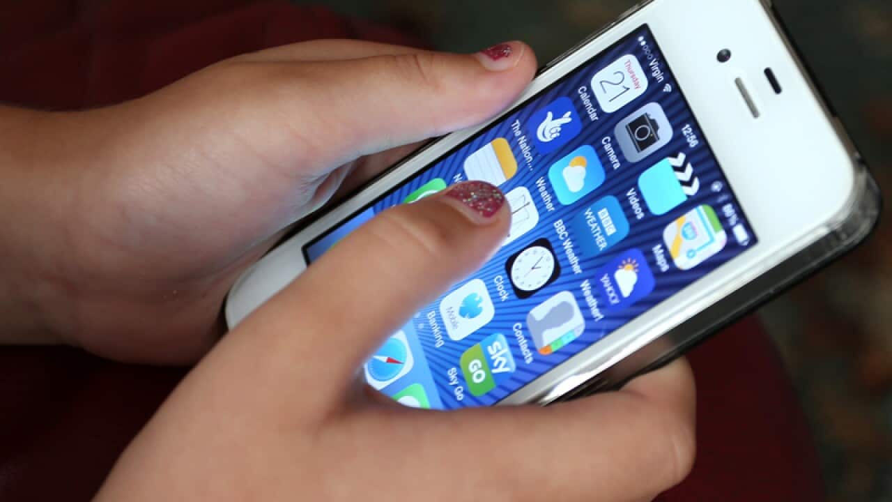 A child holding a smartphone