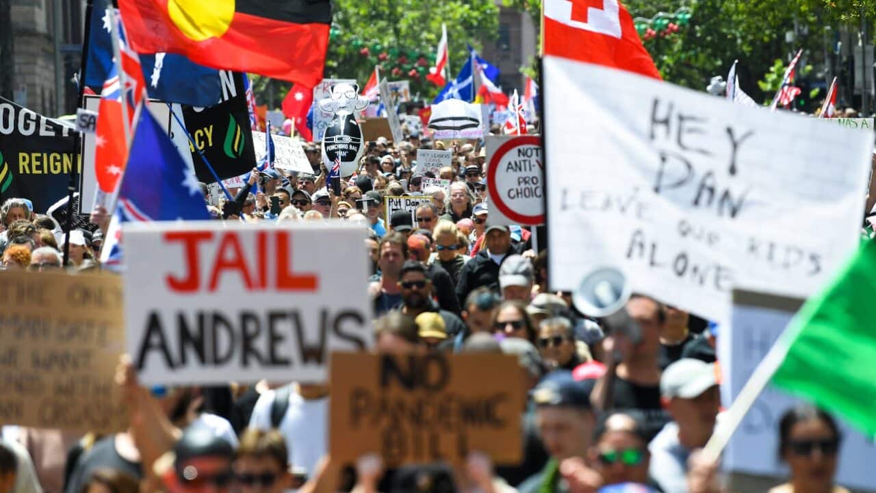 People participate in 'The Worldwide Rally for Freedom' protest against in Melbourne, Saturday, 20 November, 2021.