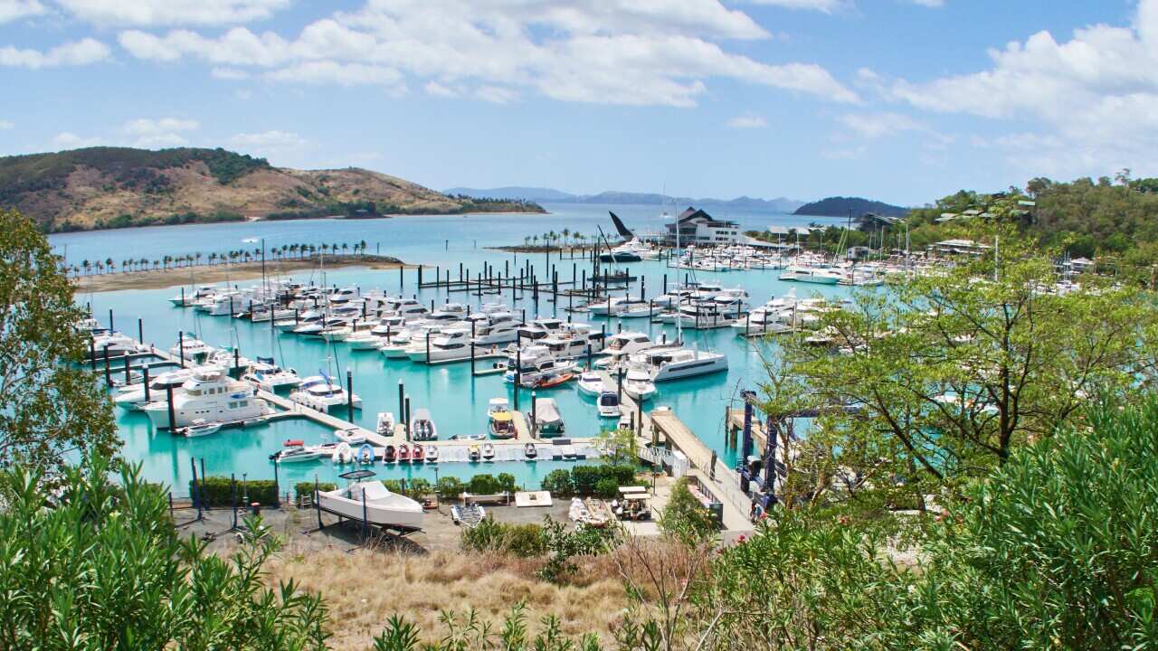 Yachts in a marina on an island.