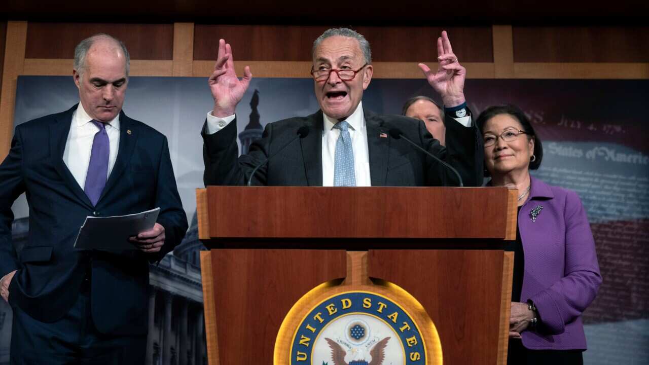 US Senate Minority Leader Chuck Schumer speaks to reporters