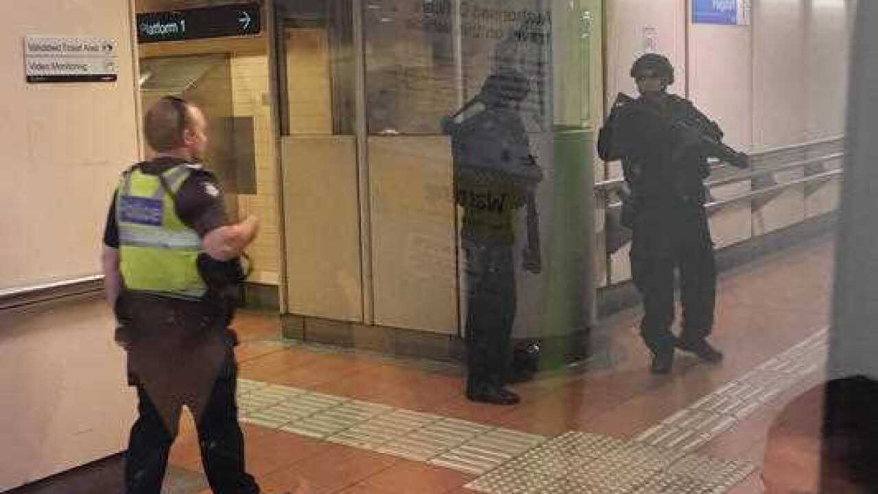 Heavily armed police inside Flagstaff Station in Melbourne.
