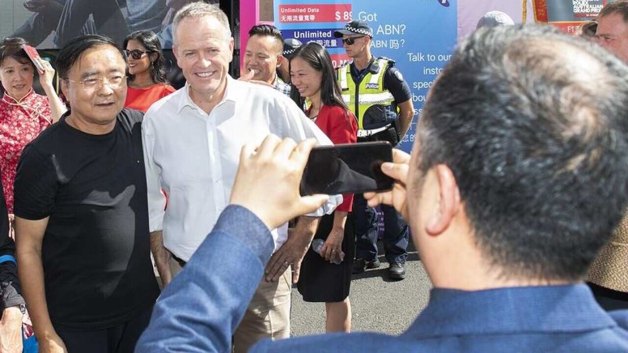 Bill Shorten poses for photos at the Chinese New Year ceremony.