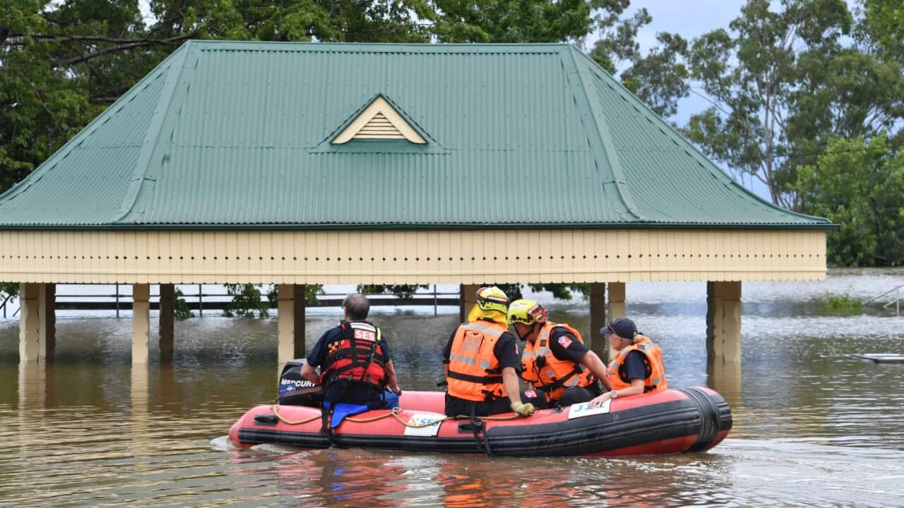 SES volunteers launch an inflatable rescue boat in Camden, South Western Sydney, Tuesday, March 8, 2022.