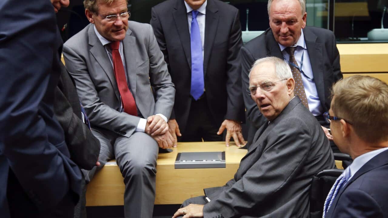 German Finance Minister Wolfgang Schaeuble talks with other ministers at the start of a special Eurogroup Finance Ministers Meeting on the Greek crisis.