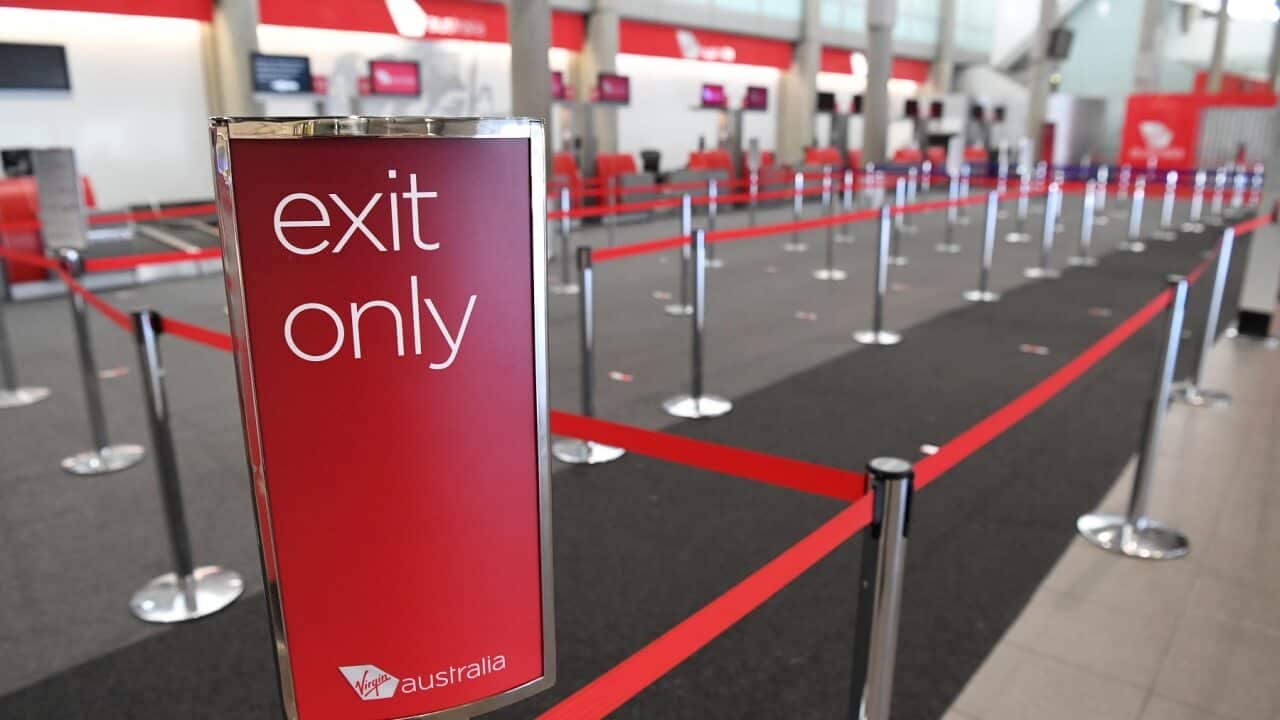 An empty Virgin Australia check-in area at Brisbane domestic airport