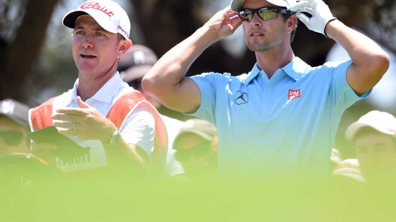 Australian golfer Adam Scott (R) and caddie Mike Kerr