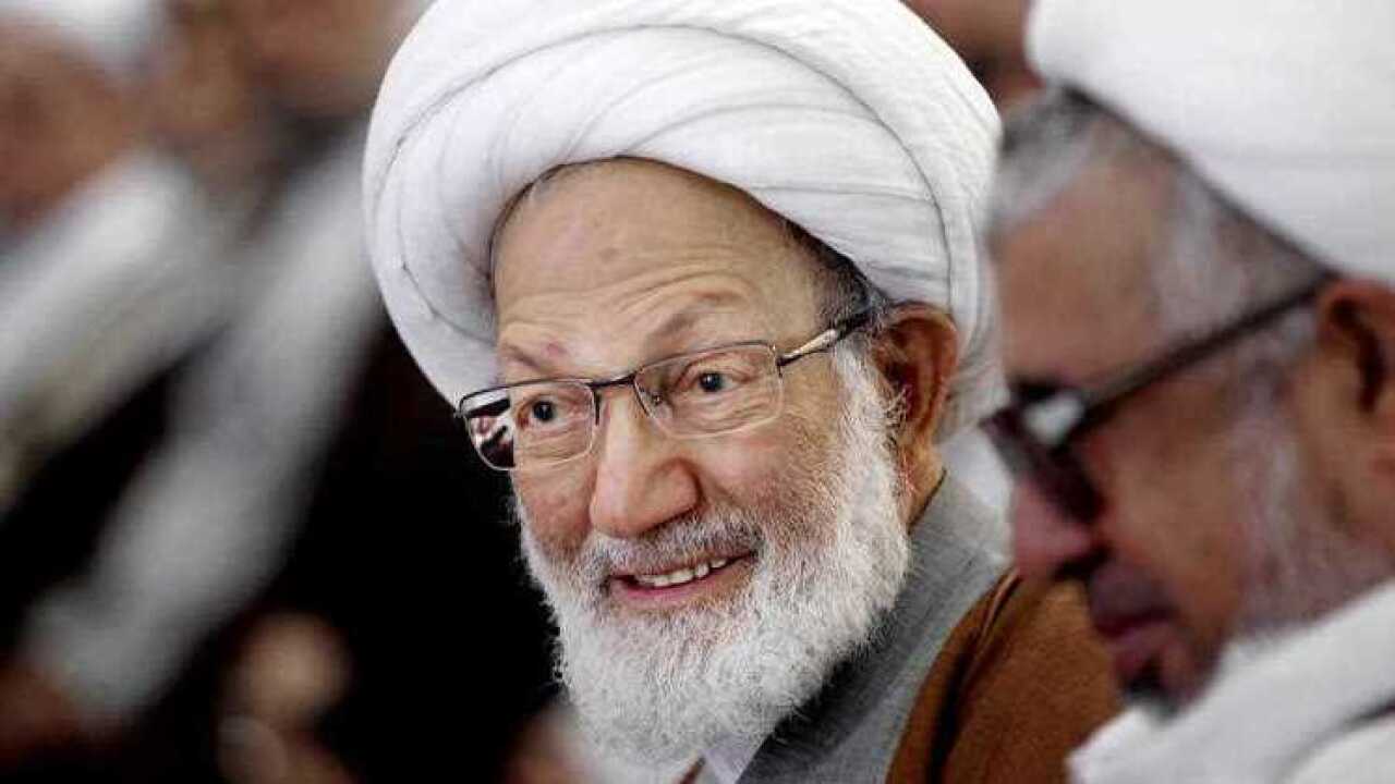 Sheik Isa Qassim, Bahrain's top Shiite Muslim cleric, center, smiles during a gathering of Shiite clerics at a mosque in Manama, Bahrain.