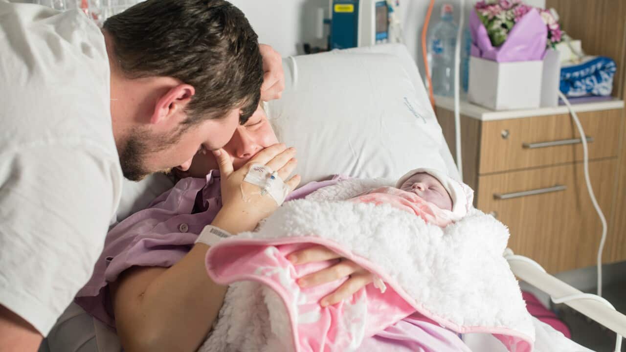 A grief stricken couple after the stillbirth of their child