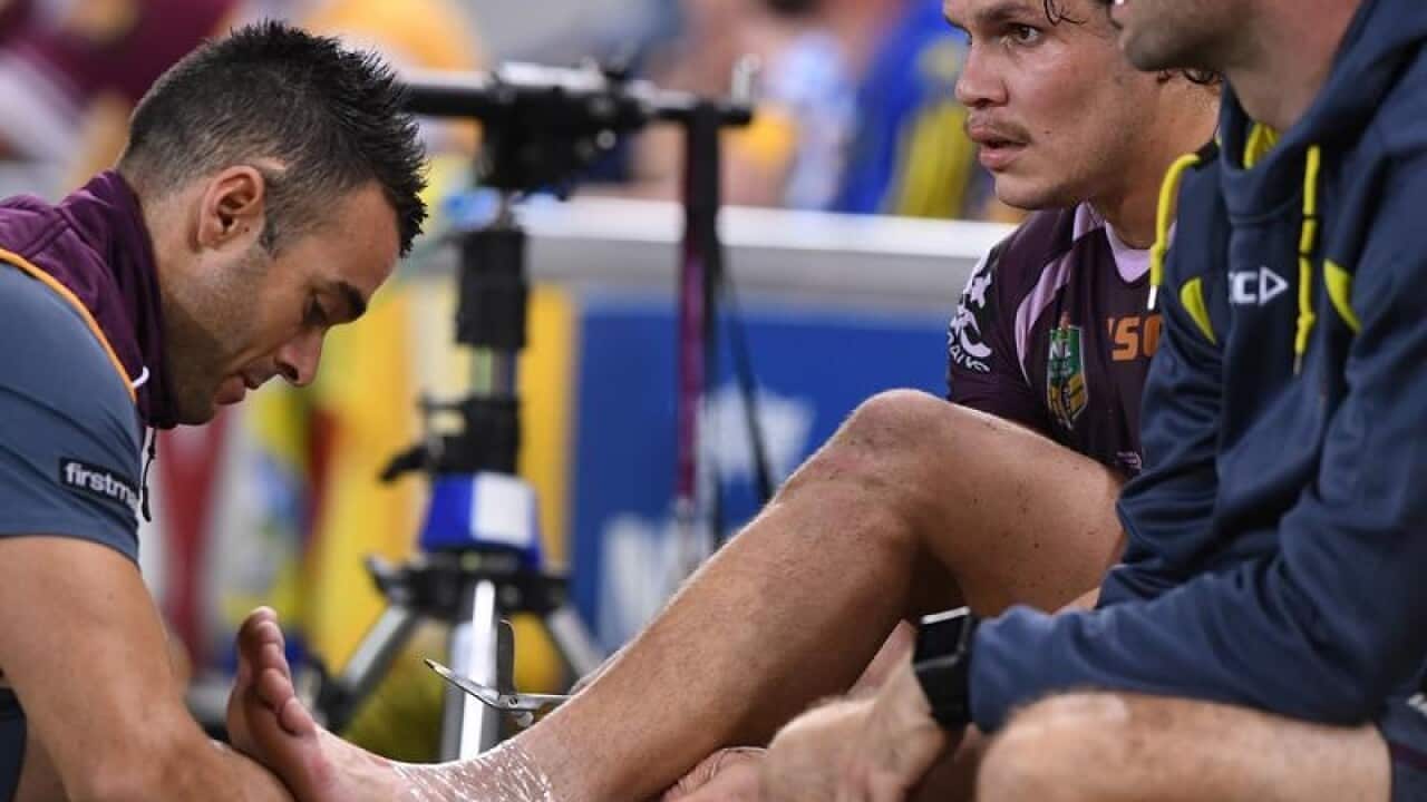 James Roberts of the Broncos has his ankle iced.