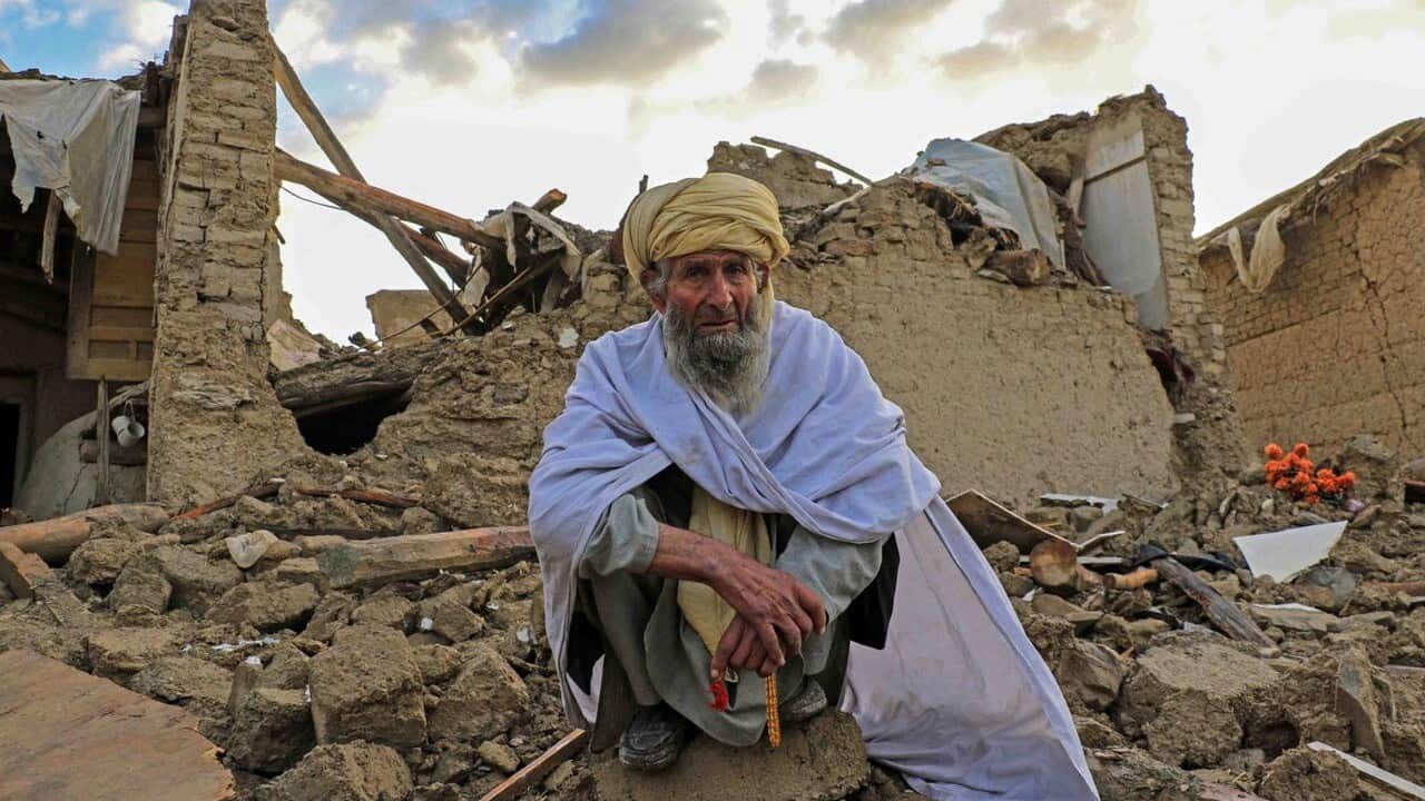 People affected by earthquake wait for relief in Gayan village in Paktia province, Afghanistan, 23 June 2022.