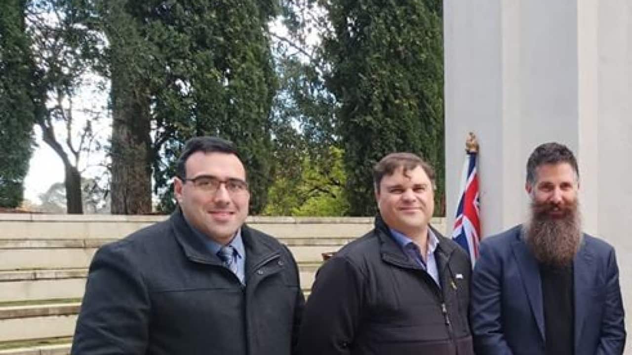 group of commemoration attendees outdoors