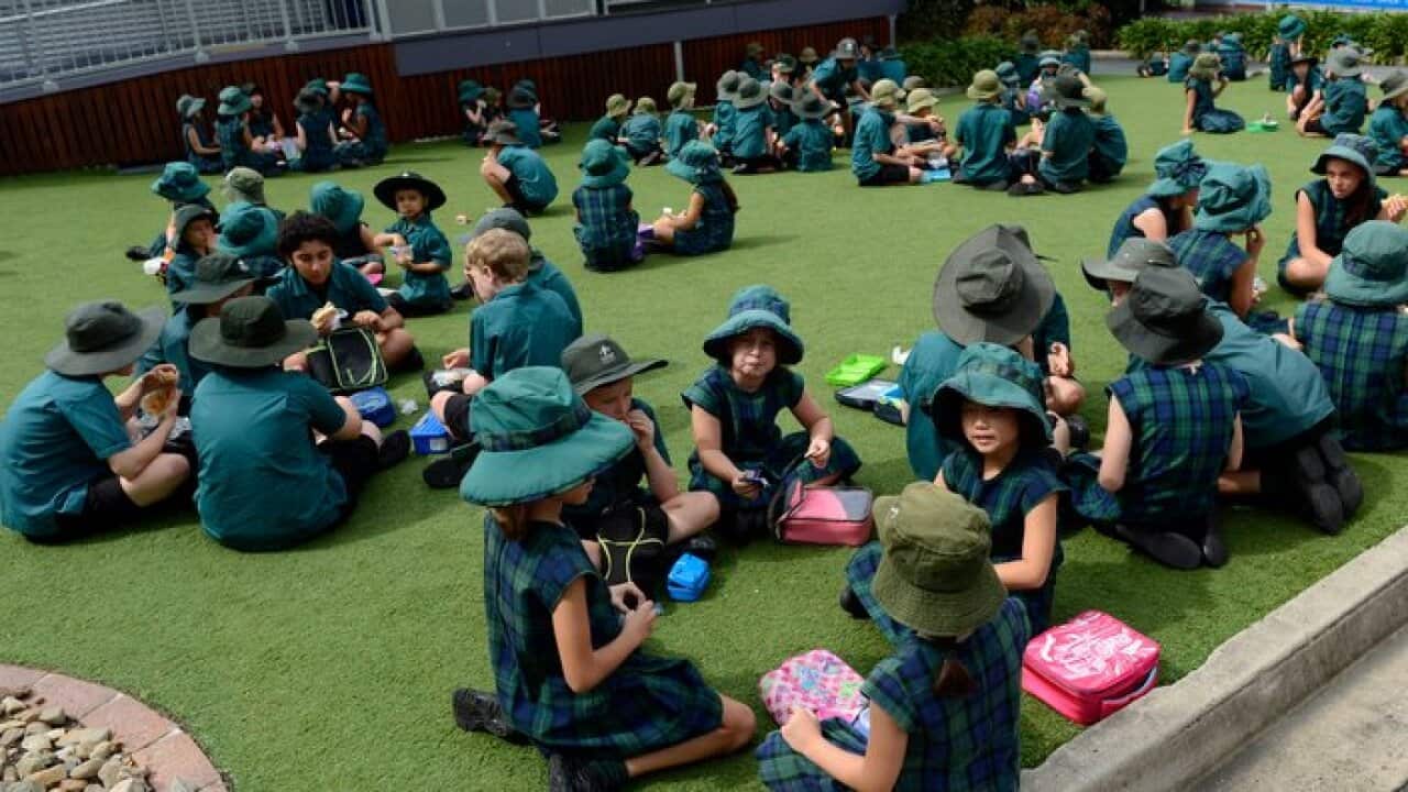 **FILE** A Monday, April 15, 2013 file photo of primary school students in Brisbane. (AAP Image/Dan Peled) NO ARCHIVING