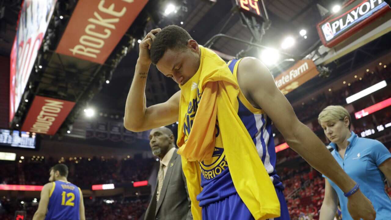 Golden State Warriors' Stephen Curry heads off the court
