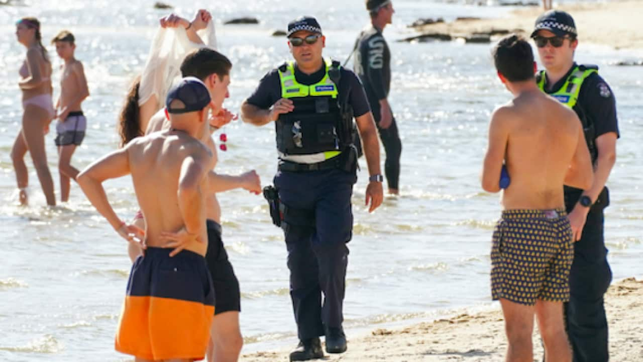 Police officers at Brighton Beach in Melbourne.