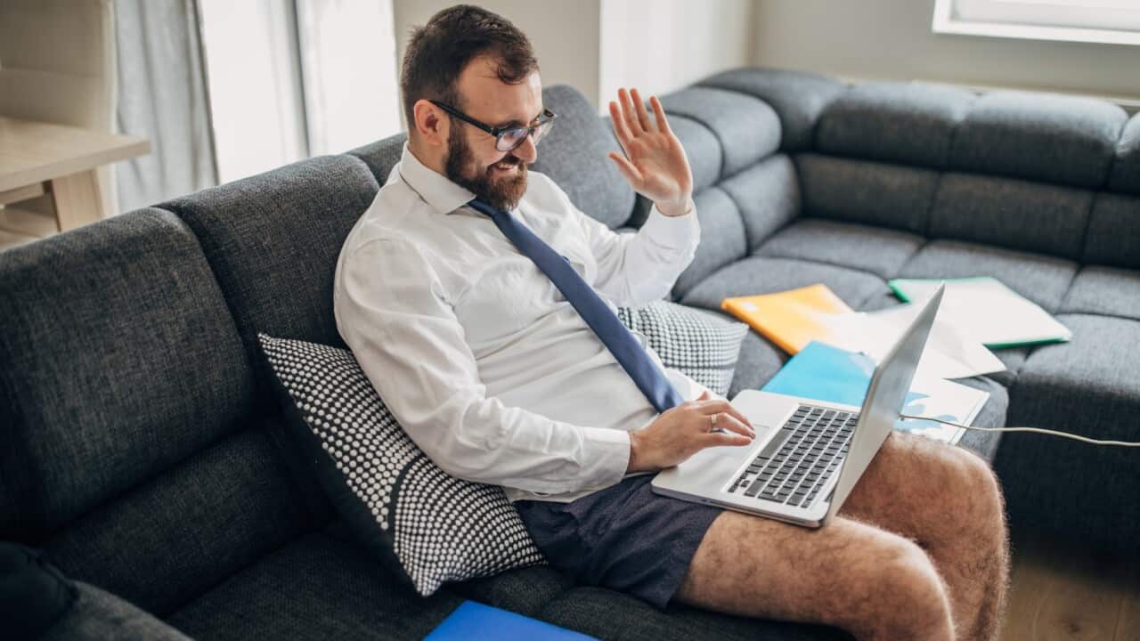 Man on couch with a laptop