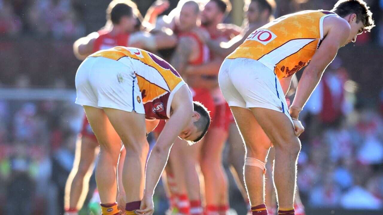 Lions' players slump on the field after their loss