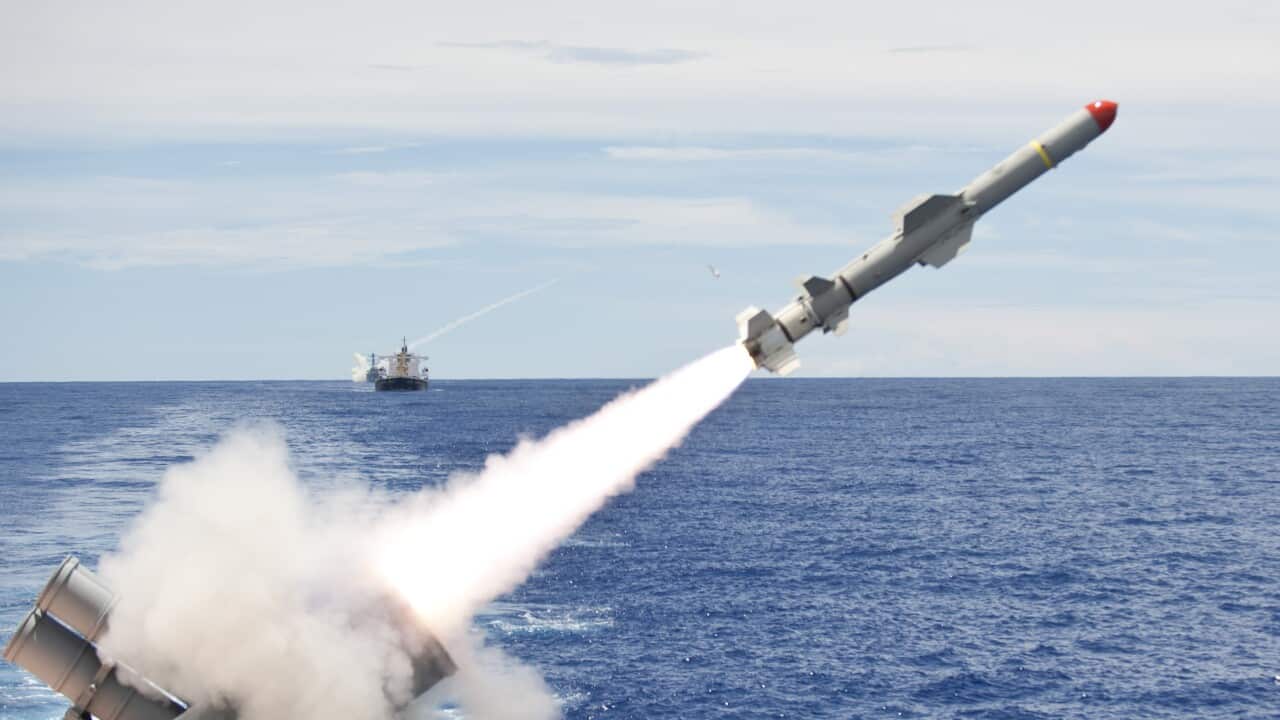 USS Cowpens launches a Harpoon missile from the aft missile deck.