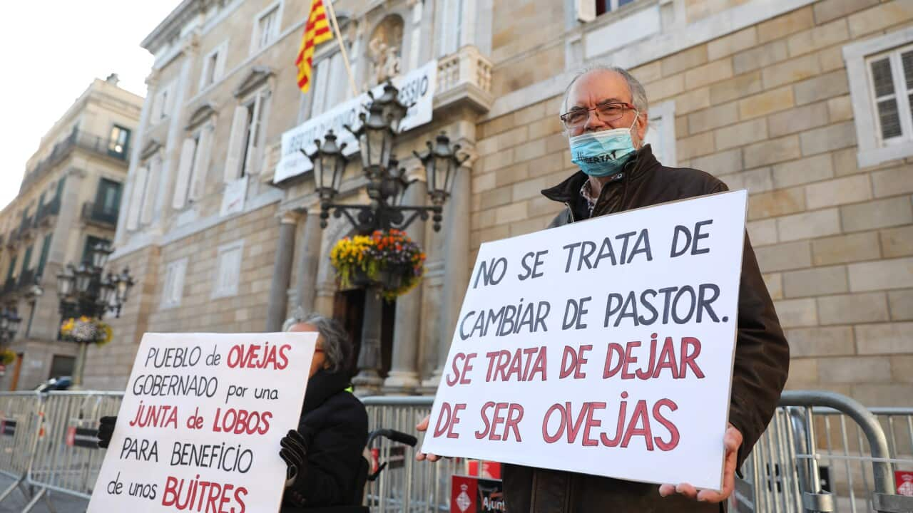 Protesters hold banners outside the Palau de la Generalitat of Catalonia in Barcelona, Catalonia, north-eastern Spain, one day prior to the election day. Picture date: February Sunday 13, 2021. Photo credit should read: Isabel Infantes.