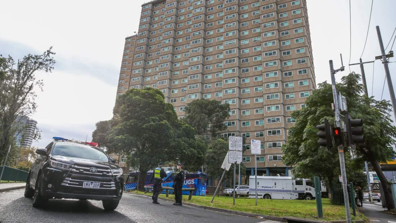 Police outside blocking the entrance of the Flemington public housing flats on 5 July, 2020 in Melbourne.