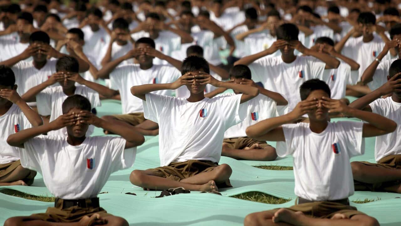 Thousands of Indian National Cadet Corps (NCC) boys and girls participate in a mass yoga sesion near Victoria Memorial during the first International Yoga Day in Calcutta, India, 21 June 2015.  (EPA)