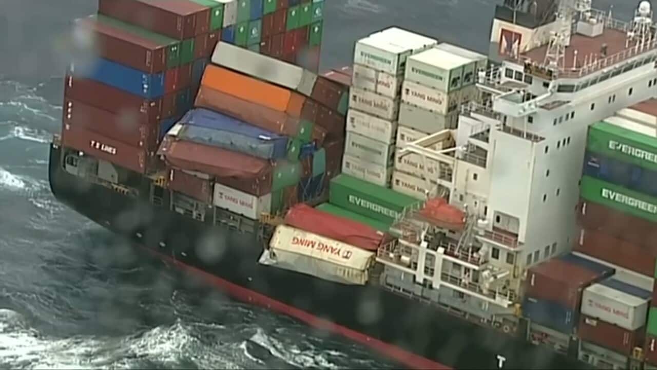 The stricken ship at sea.