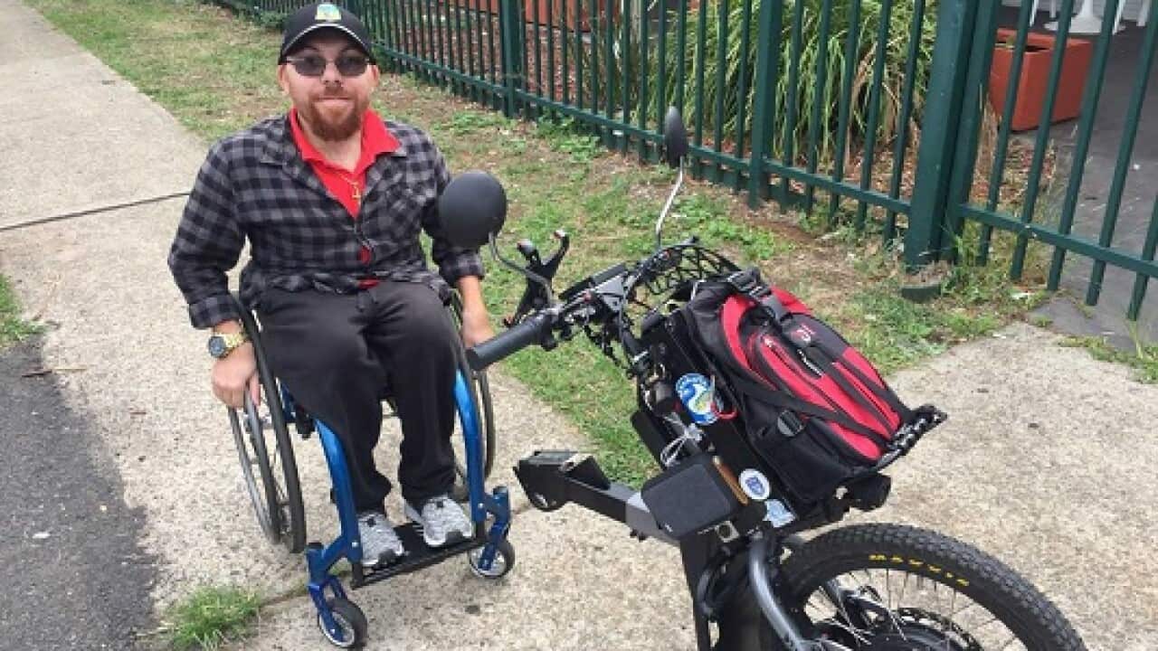 Ralph Hasna with his wheelchair accessory