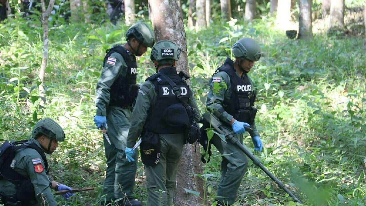 A Royal Thai police bomb disposal team at a rubber plantation in Yala on July 2, 2018