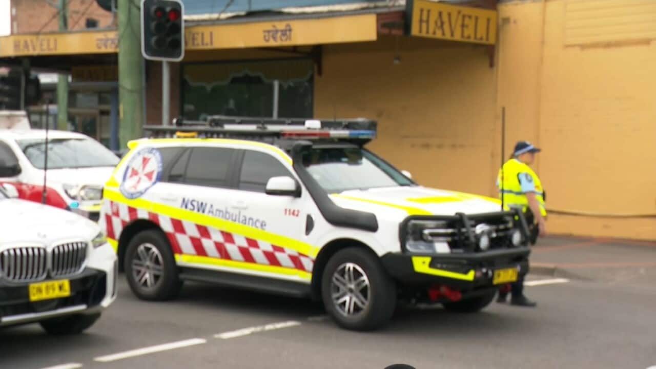 A NSW Ambulance vehicle in front of a restaurant