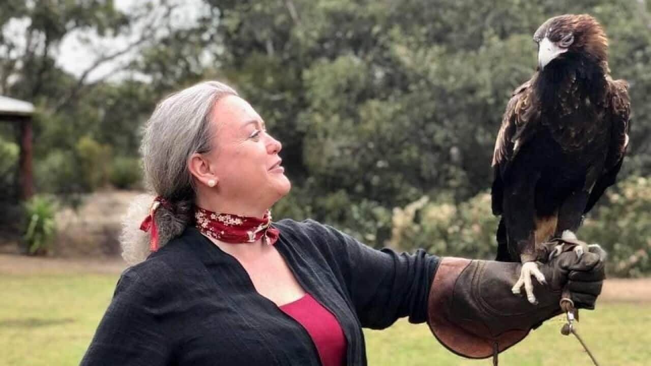 Luciana D'Arcangeli with a falcon