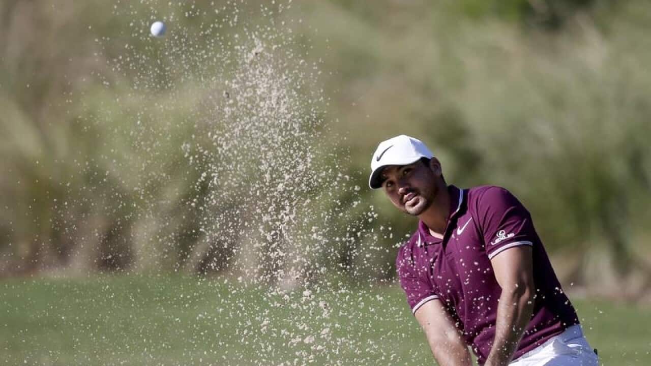 Australia's Jason Day plays from a bunker