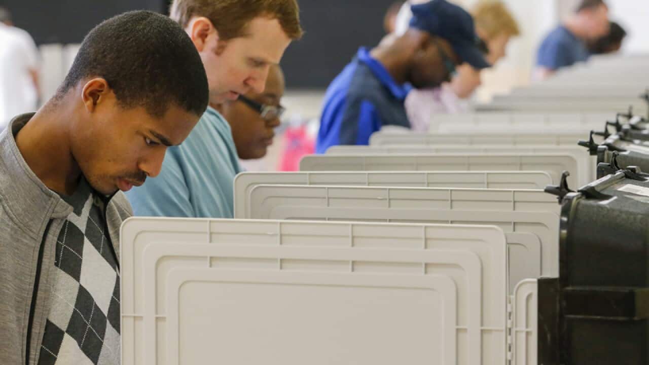 Voters participate in early voting in Georgia