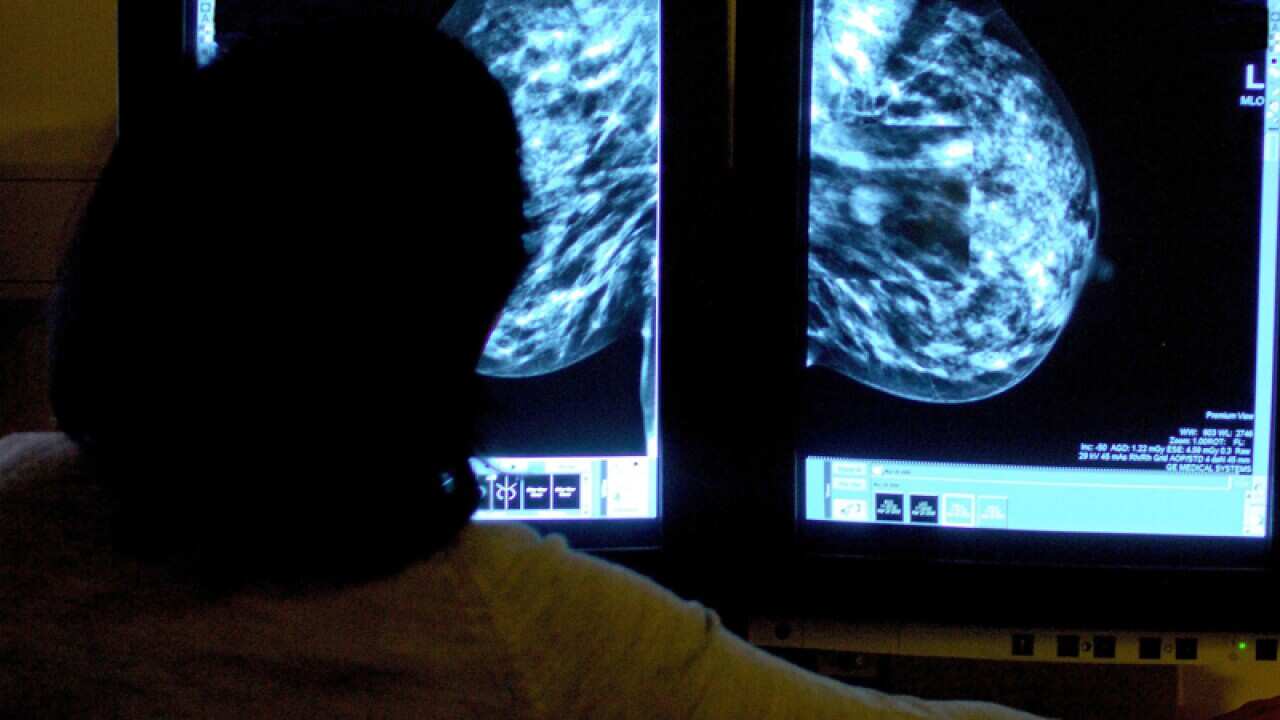 A consultant studying a mammogram