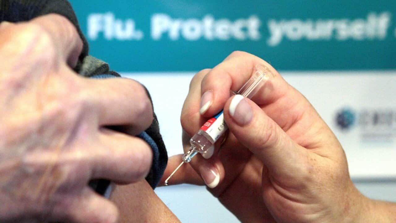 A person getting a flu jab
