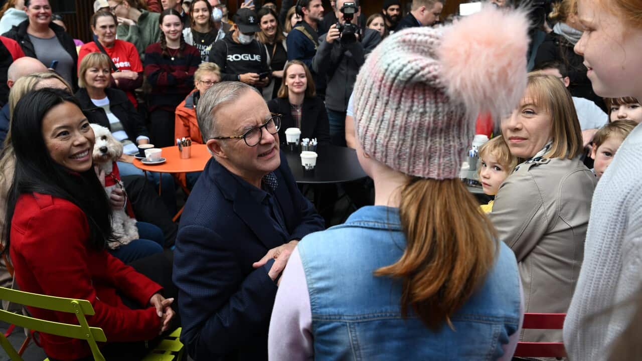 Incoming prime minister Anthony Albanese chats and poses for pictures.