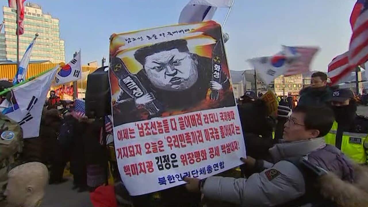 Hundreds of anti-North Korea protesters scuffled with riot police
