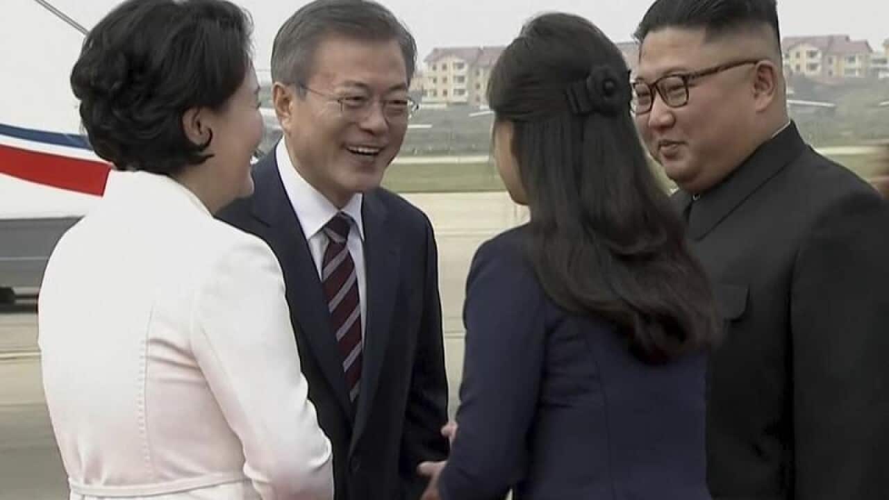 Leaders of South and North Korea with their wives.