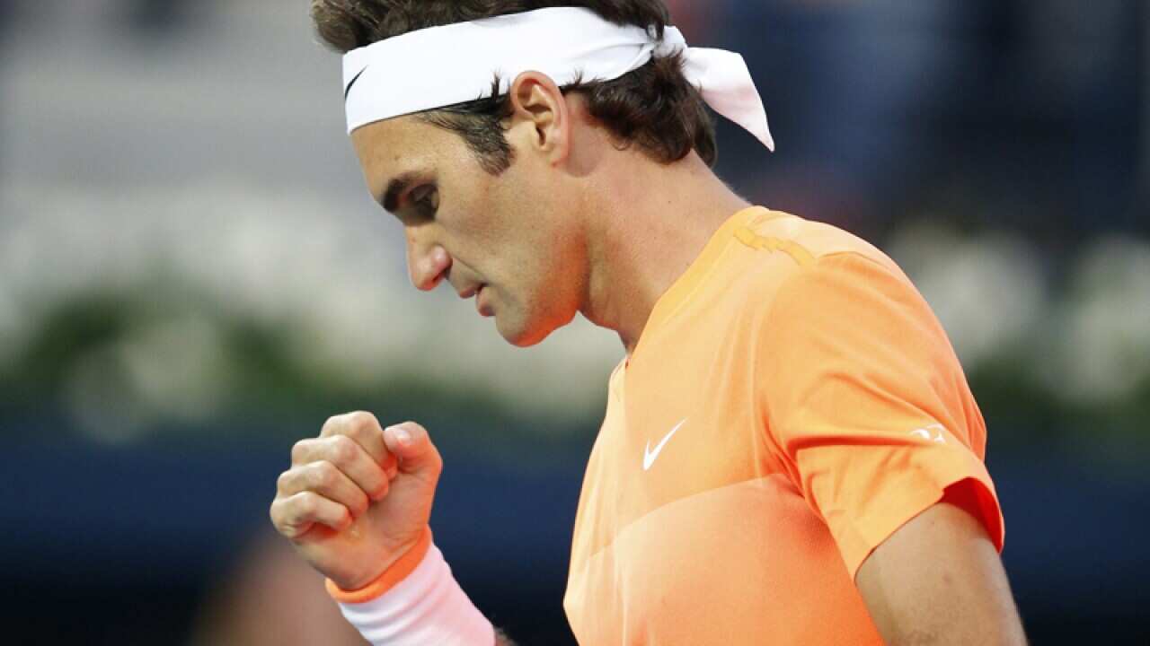 Roger Federer of Switzerland celebrates a point against Borna Coric