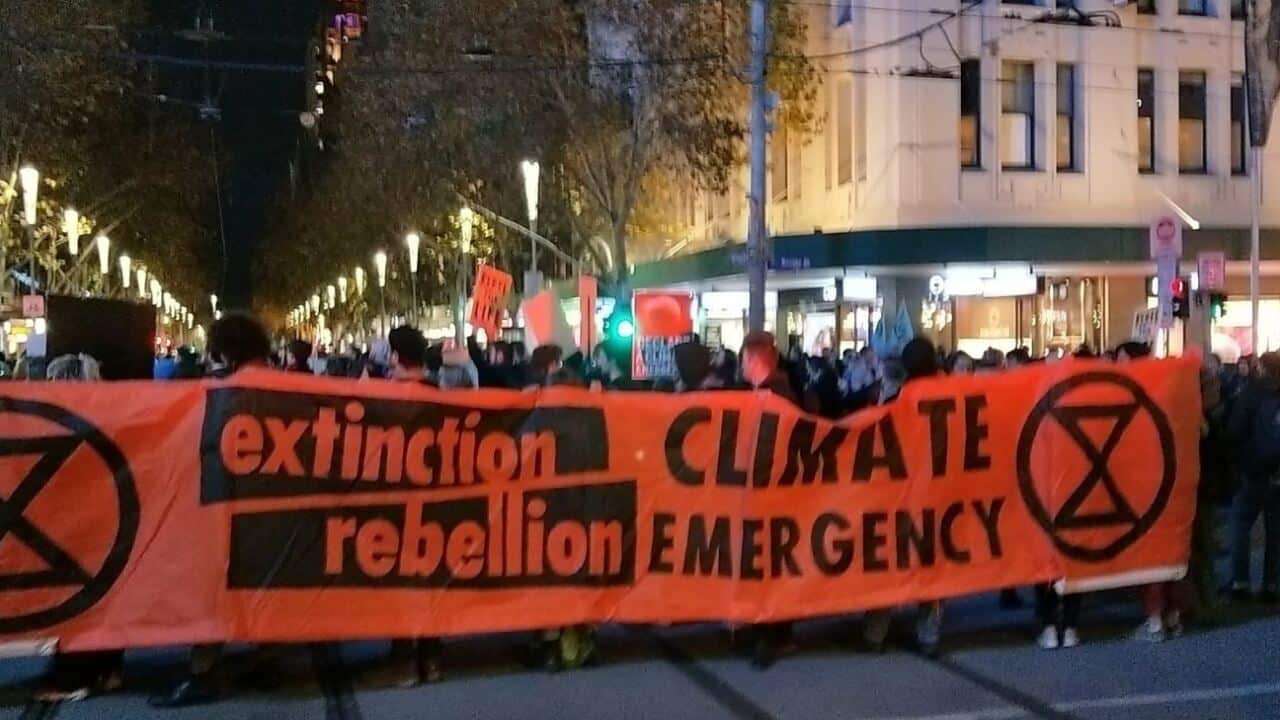 Extinction Rebellion activists are protesting against the Adani coal mine in Australian cities tonight. 