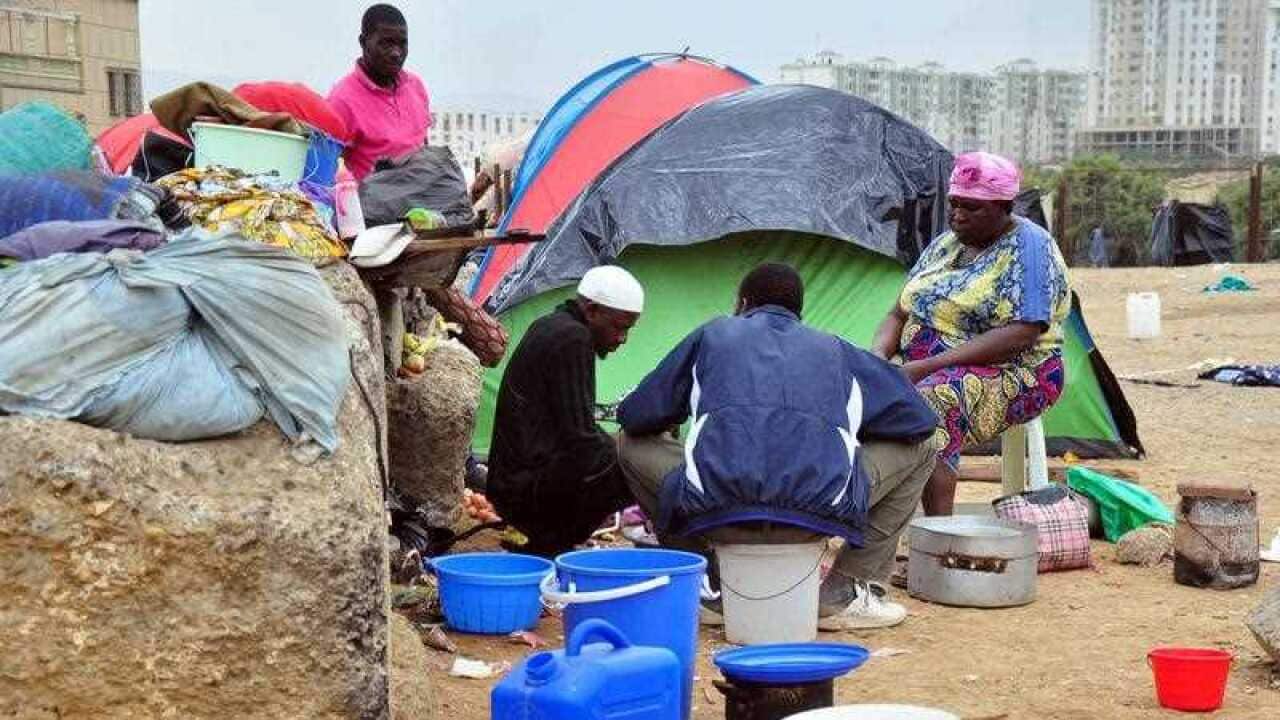 Algeria, Ain Naadja : African migrants are seen cooking in insalubrity conditions at the Ain Naadja's migrant camp