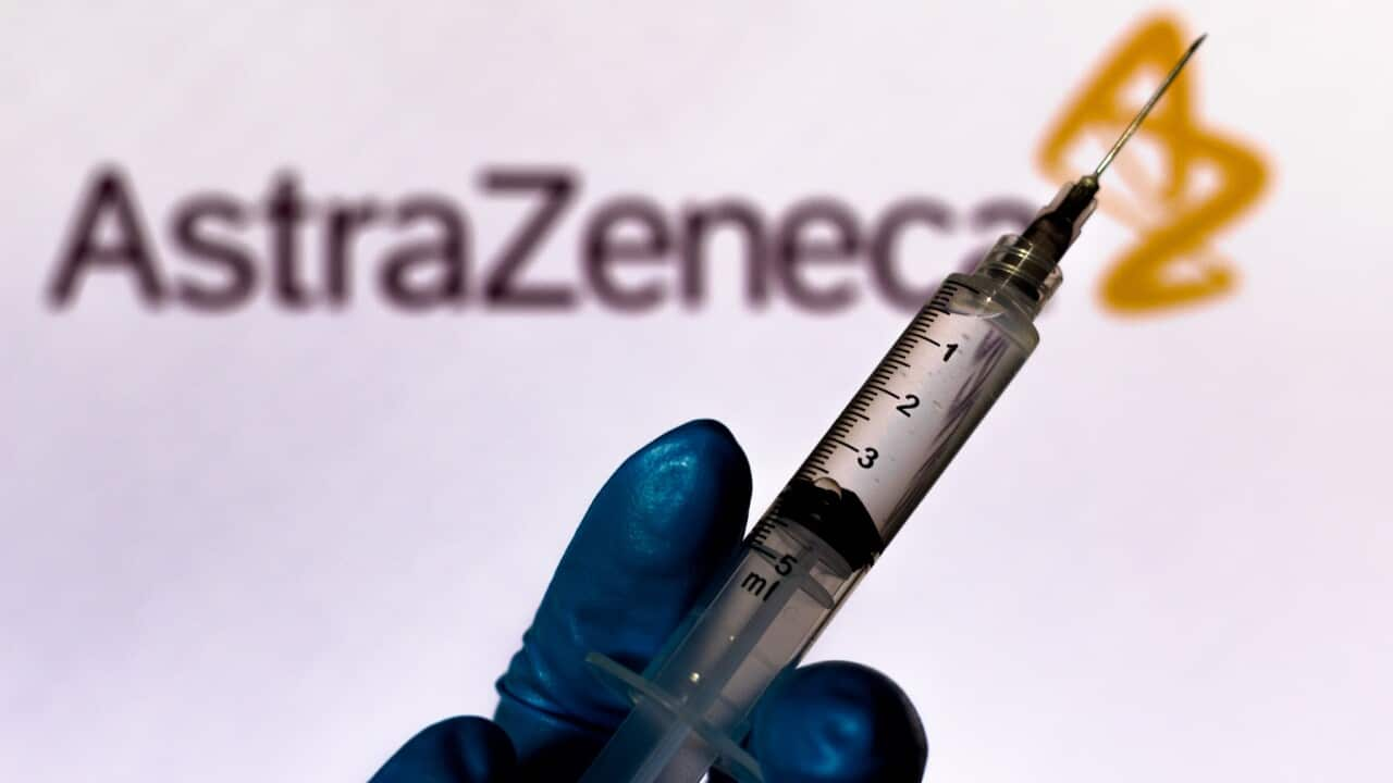 medical syringe is seen with AstraZeneca company logo