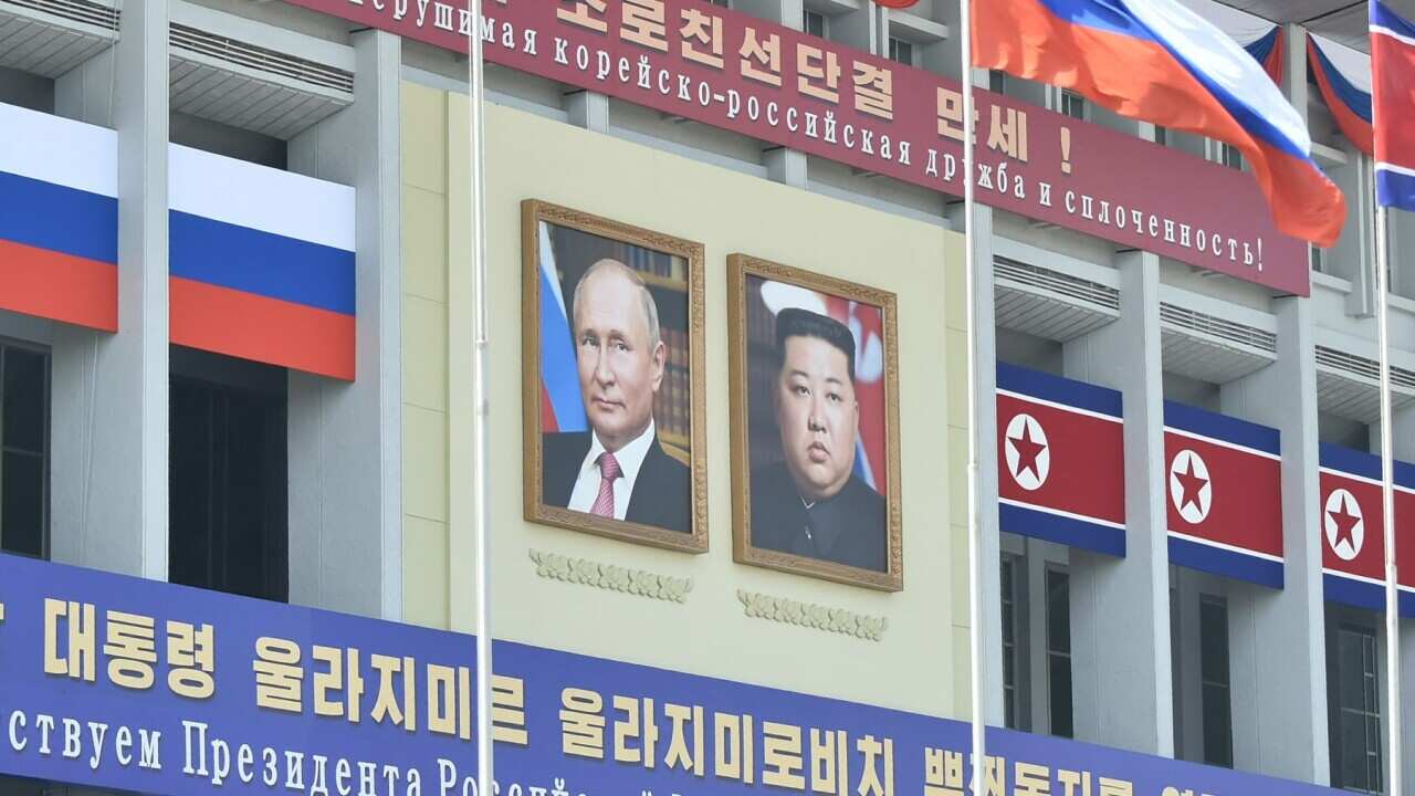 Portraits of Russian President Vladimir Putin (L) and North Korea's leader Kim Jong Un in Pyongyang (Getty)_.jpg